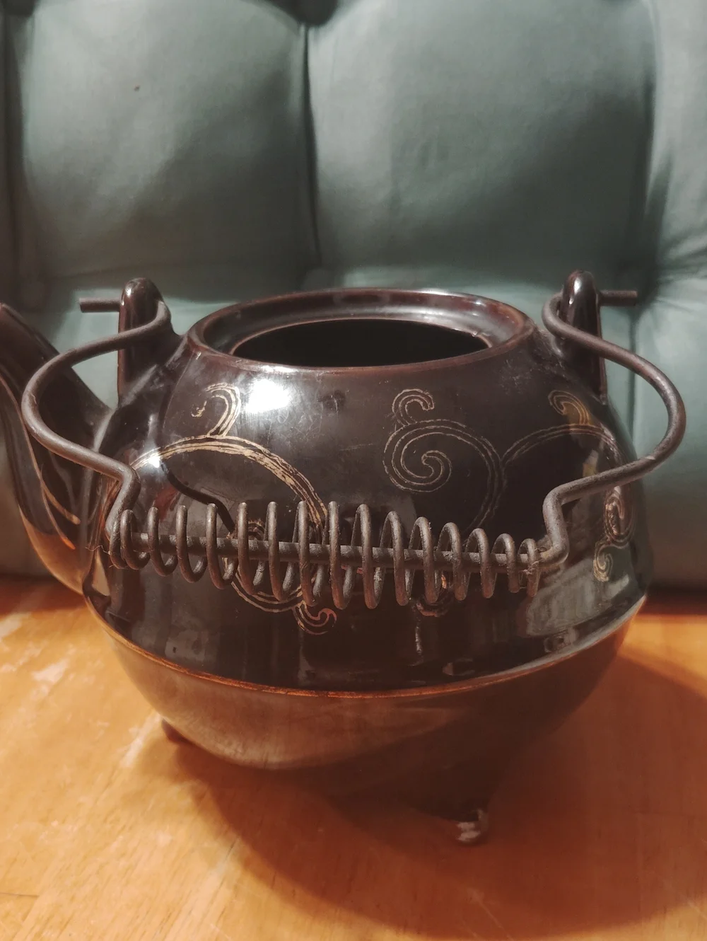 Brown Ceramic Teapot with Swirl Design and Metal Handle